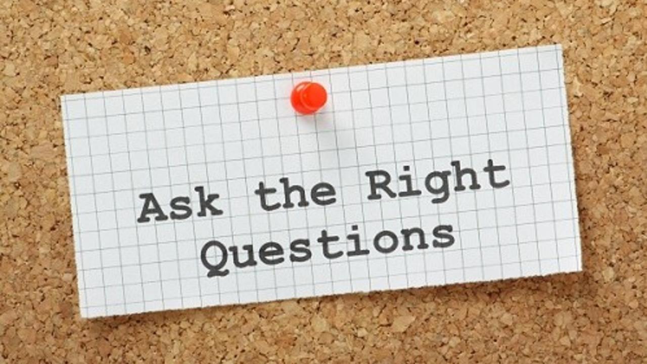 Ask The Right Questions on a cork notice board